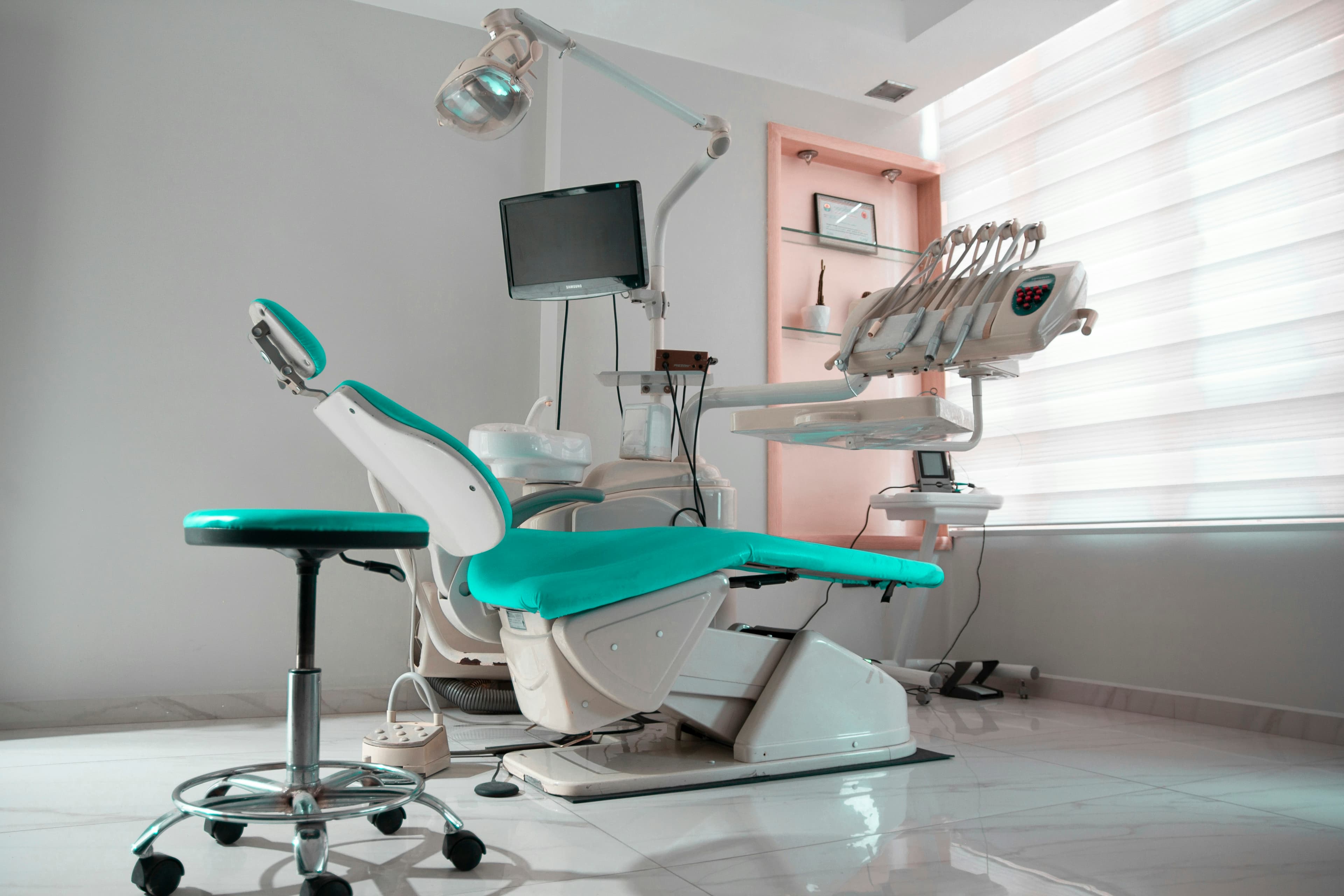 Clean, modern dental treatment room with a dental chair
